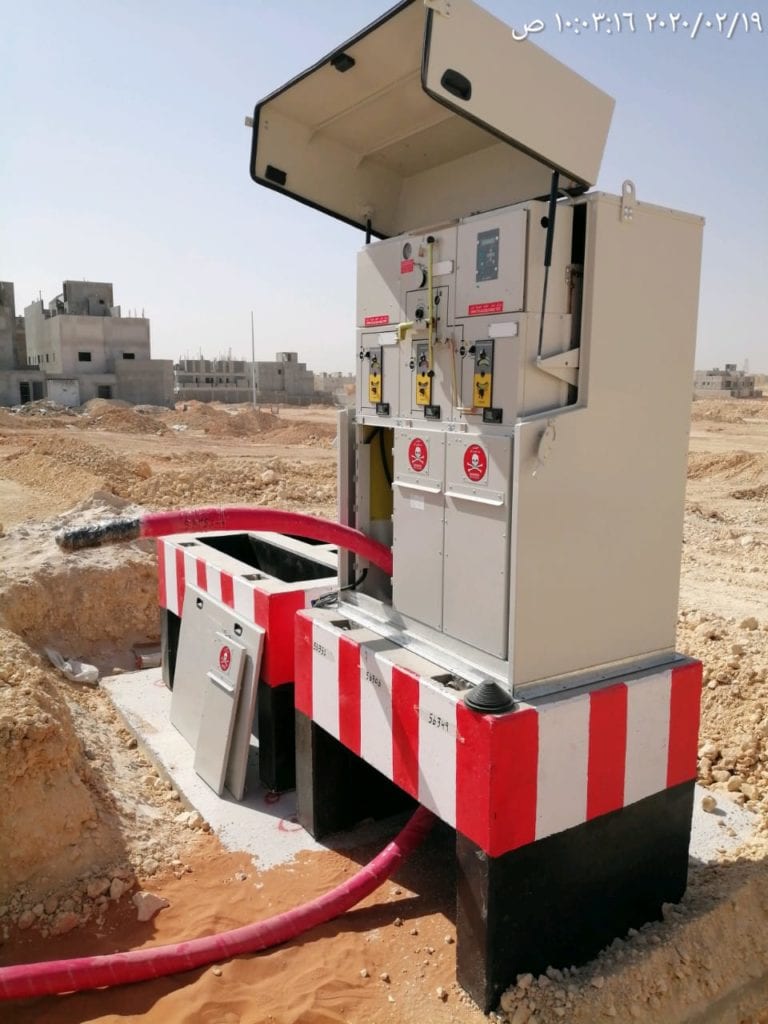 A medium-voltage ring main unit on its concrete plinth with cable chambers, feeding a street lighting network on a new development